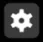 The gear button, a white cog on a dark square, which opens the File Manager Settings window.
